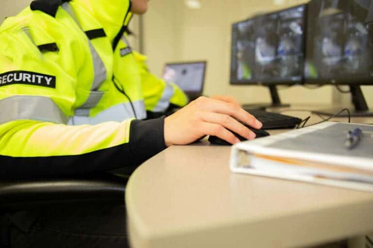 Home 1 Security team watching over CCTV surveillance monitors.